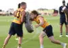 MELBOURNE, AUSTRALIA - JANUARY 22: Jack Ginnivan is tackled by Dylan Moore of the Hawks during a Hawthorn Hawks AFL training session at Kennedy Community Centre on January 22th, 2026 in Melbourne, Australia. (Photo by James Wiltshire/AFL Photos via Getty Images)
