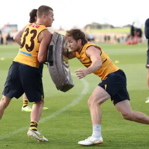 MELBOURNE, AUSTRALIA - JANUARY 22: Jack Ginnivan is tackled by Dylan Moore of the Hawks during a Hawthorn Hawks AFL training session at Kennedy Community Centre on January 22th, 2026 in Melbourne, Australia. (Photo by James Wiltshire/AFL Photos via Getty Images)