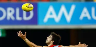 FINAL TEAMS: Gold Coast vs Geelong – Round 0, 2026 GOLD COAST, AUSTRALIA - FEBRUARY 19: Christian Petracca of the Suns in action during the 2026 AFL match simulation between the Gold Coast Suns and the St Kilda Saints at People First Stadium on February 19, 2026 in the Gold Coast, Australia. (Photo by Russell Freeman/AFL Photos via Getty Images)