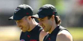 Scott heaps praise on new skipper while vowing to support his predecessor MELBOURNE, AUSTRALIA - FEBRUARY 16: Zach Merrett and Andrew McGrath of the Bombers chat during an Essendon Bombers AFL training session at The Hangar on February 16, 2026 in Melbourne, Australia. (Photo by Quinn Rooney/Getty Images)