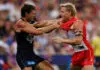 SYDNEY, AUSTRALIA - MARCH 5: Oliver Florent of the Blues and Isaac Heeney of the Swans wrestle during the 2026 AFL Opening Round match between the Sydney Swans and the Carlton Blues at the Sydney Cricket Ground on March 5, 2026 in Sydney, Australia. (Photo by Michael Willson/AFL Photos via Getty Images)