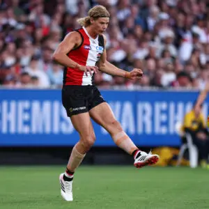 MELBOURNE, AUSTRALIA - MARCH 08: Tom De Koning of the Saints kicks the ball during the AFL Opening Round match between St Kilda Saints and Collingwood Magpies at Melbourne Cricket Ground, on March 08, 2026, in Melbourne, Australia. (Photo by Daniel Pockett/Getty Images)