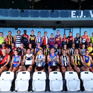 MELBOURNE, AUSTRALIA - MARCH 10: Top Row (L-R) Boundary Umpire Dom Schiliro, Stu Horner of the Hawks, Daniel Capiron of the Cats, Wardell Lual of the Demons, Jesse Clark of Werribee, Matthew Keast of the Kangaroos, Billy McGee-Galimberti of the Saints, Eloise Ashley-Cooper of Port Melbourne, Fergus McFadyen of the Lions, Zoe Mitchell of the Demons, Xavier O'Neill of the Bombers, Octavia Di Donato of the Blues, Ryan Hebron of the Giants and Boundary Umpire Tahlia Merrett, Middle Row (L-R) Charlie Peters of the Swans, Alex Sexton of the Suns, Jesse Corigliano of Coburg, Trent Mynott of Frankston, Lulu Beatty of the Falcons, Finn O'Dwyer of Williamstown, Grace Hodder of Sandringham, Jack Sammartino of the Blues, Rosie Dillon of the Hawks, Brady Grey of the Magpies, Melanie Staunton of the Cats, Lachlan Street of the Tigers and Kaine Baldwin of Port Melbourne, Bottom Row (L-R) Robbie Fox of the Devils, El Chaston of the Bombers, Steph Asciak of the Bulldogs, Zac Foot of the Sharks, Renee Tierney of the Kangaroos, Dan Orgill of the Bulldogs, Dom Carbone of the Magpies, Blake Watson of Sandringham, Eliza Straford of Williamstown and Georgia Hill of the Devils pose with the 2026 VFL and VFLW Premiership Cups during the 2026 VFL/W Season Launch at Whitten Oval on March 10, 2026 in Melbourne, Australia. (Photo by Josh Chadwick/AFL Photos/via Getty Images)
