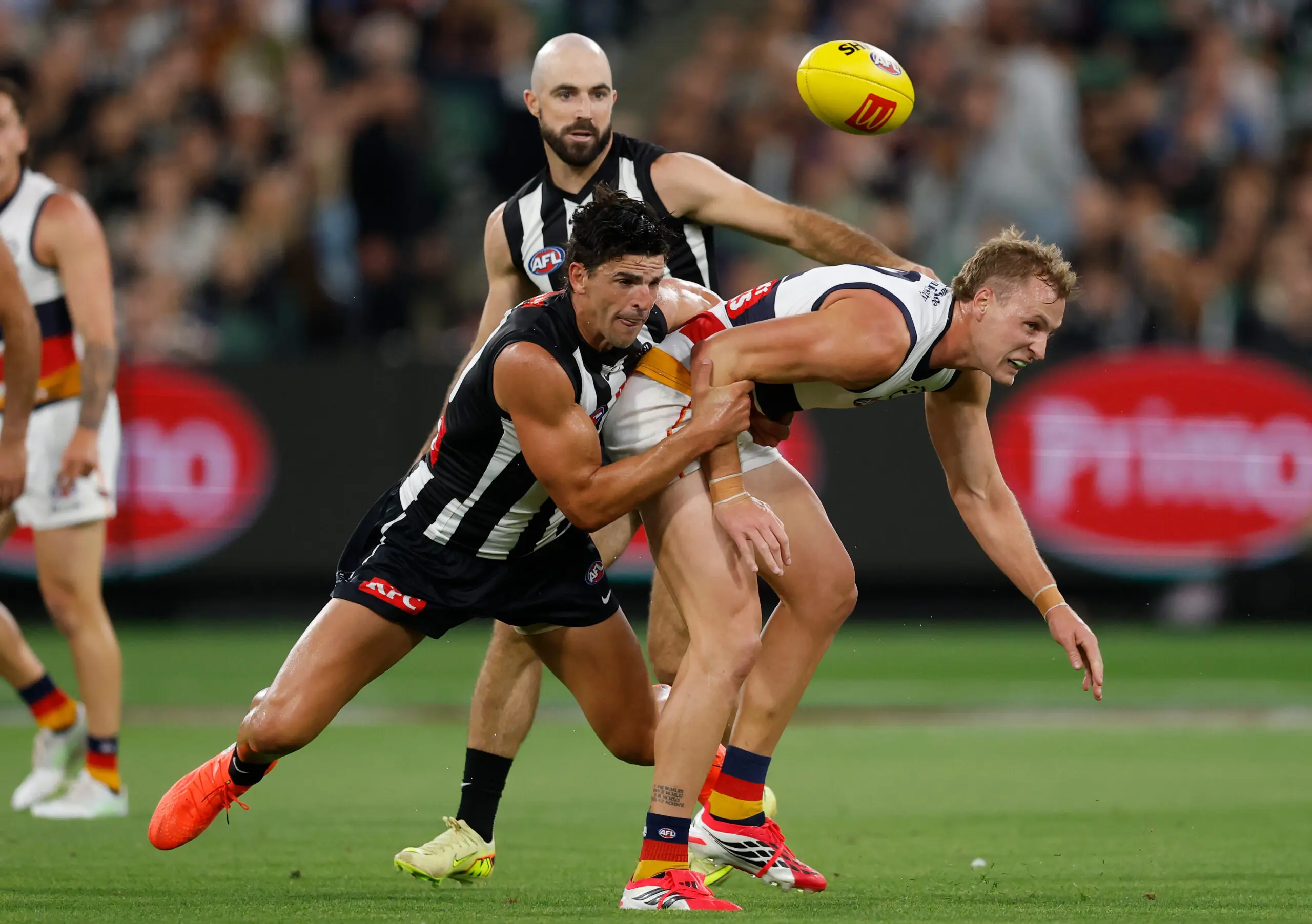 MELBOURNE, AUSTRALIA - MARCH 14: Jordan Dawson of the Crows is tackled by Scott Pendlebury of the Magpies during the 2026 AFL Round 01 match between the Collingwood Magpies and the Adelaide Crows at the Melbourne Cricket Ground on March 14, 2026 in Melbourne, Australia. (Photo by Michael Willson/AFL Photos via Getty Images)