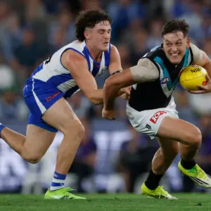 MELBOURNE, AUSTRALIA - MARCH 15: Zak Butters of the Power is tackled by Lachy Dovaston of the Kangaroos during the 2026 AFL Round 01 match between the North Melbourne Kangaroos and the Port Adelaide Power at Marvel Stadium on March 15, 2026 in Melbourne, Australia. (Photo by Michael Willson/AFL Photos via Getty Images)