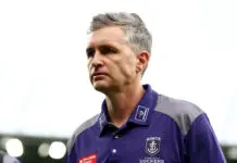 GEELONG, AUSTRALIA - MARCH 14: Justin Longmuir, Senior Coach of the Dockers looks dejected after losing the round one AFL match between Geelong Cats and Fremantle Dockers at GMHBA Stadium, on March 14, 2026, in Geelong, Australia. (Photo by Josh Chadwick/Getty Images)
