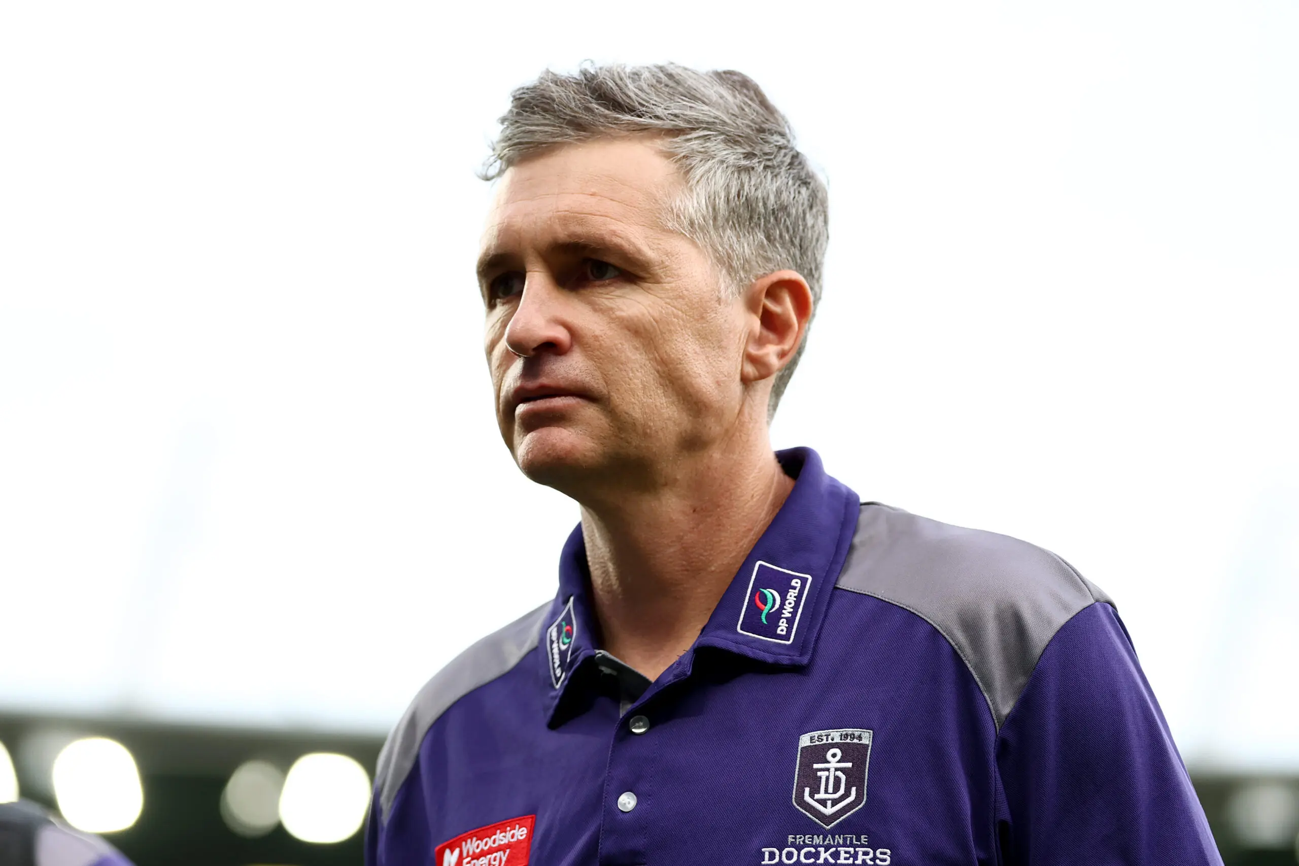 GEELONG, AUSTRALIA - MARCH 14: Justin Longmuir, Senior Coach of the Dockers looks dejected after losing the round one AFL match between Geelong Cats and Fremantle Dockers at GMHBA Stadium, on March 14, 2026, in Geelong, Australia. (Photo by Josh Chadwick/Getty Images)