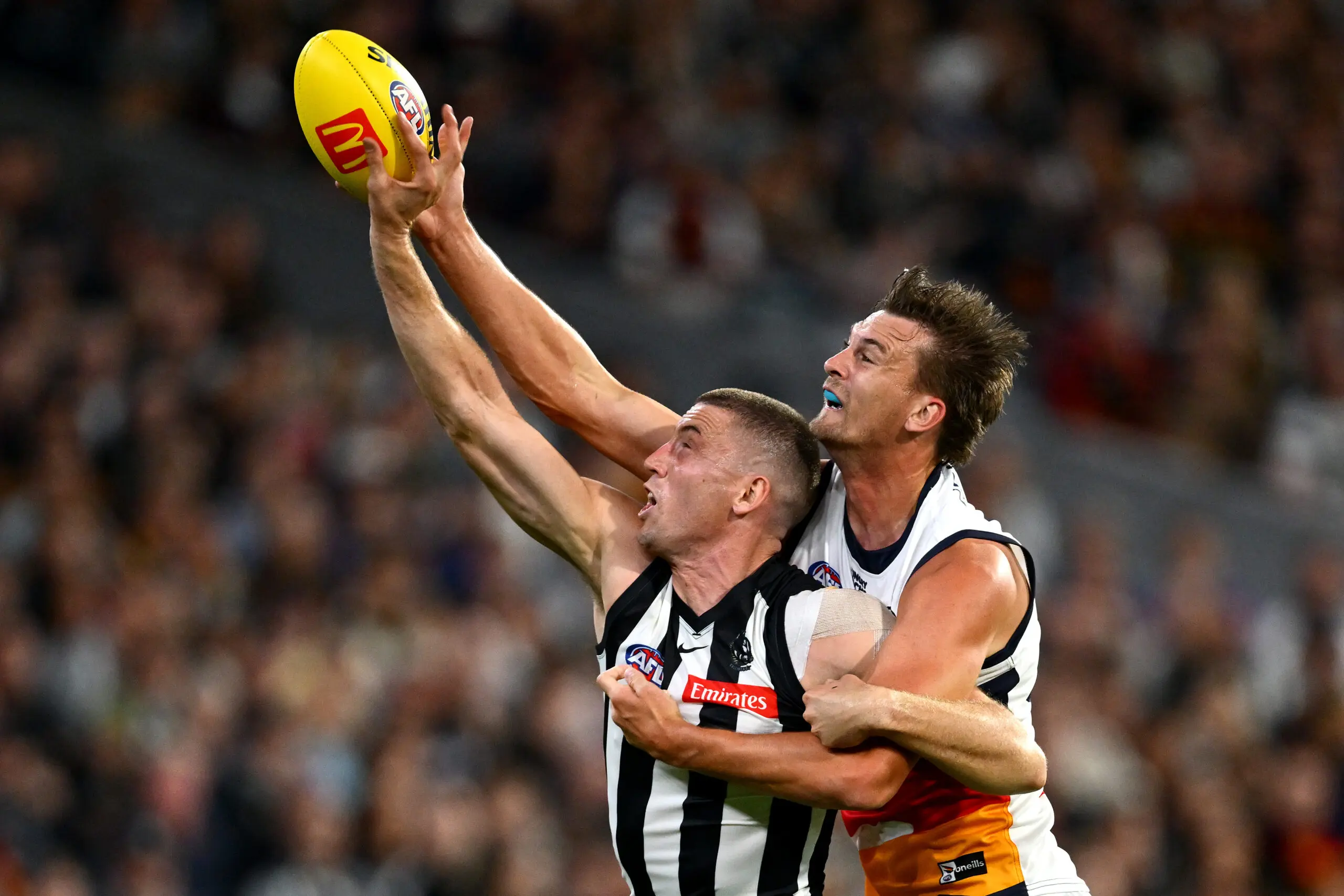 MELBOURNE, AUSTRALIA - MARCH 14: Darcy Cameron of the Magpies and Lachlan McAndrew of the Crows compete in the ruck during the round one AFL match between Collingwood Magpies and Adelaide Crows at Melbourne Cricket Ground, on March 14, 2026, in Melbourne, Australia. (Photo by Quinn Rooney/Getty Images)