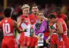 SYDNEY, AUSTRALIA - MARCH 14:  Isaac Heeney of the Swans celebrates with team mates after kicking a goal during the round one AFL match between Sydney Swans and Brisbane Lions at Sydney Cricket Ground, on March 14, 2026, in Sydney, Australia. (Photo by Matt King/AFL Photos/via Getty Images)