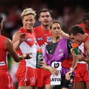 SYDNEY, AUSTRALIA - MARCH 14:  Isaac Heeney of the Swans celebrates with team mates after kicking a goal during the round one AFL match between Sydney Swans and Brisbane Lions at Sydney Cricket Ground, on March 14, 2026, in Sydney, Australia. (Photo by Matt King/AFL Photos/via Getty Images)