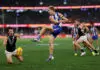 MELBOURNE, AUSTRALIA - MARCH 15: Connor Rozee of the Power smothers a kick from Dylan Stephens of the Kangaroos during the round one AFL match between North Melbourne Kangaroos and Port Adelaide Power at Marvel Stadium, on March 15, 2026, in Melbourne, Australia. (Photo by Morgan Hancock/Getty Images)