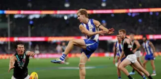 Headed North: the Kangaroos turn in a commanding performance to open their 2026 account MELBOURNE, AUSTRALIA - MARCH 15: Connor Rozee of the Power smothers a kick from Dylan Stephens of the Kangaroos during the round one AFL match between North Melbourne Kangaroos and Port Adelaide Power at Marvel Stadium, on March 15, 2026, in Melbourne, Australia. (Photo by Morgan Hancock/Getty Images)