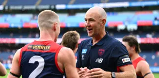 “Demon football”: The main changes Steven King unveiled in debut Melbourne win MELBOURNE, AUSTRALIA - MARCH 15: Steven King, Senior Coach of the Demons and Jacob van Rooyen of the Demons celebrate winning the round one AFL match between Melbourne Demons and St Kilda Saints at Melbourne Cricket Ground, on March 15, 2026, in Melbourne, Australia. (Photo by Quinn Rooney/Getty Images)
