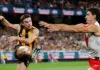 MELBOURNE, AUSTRALIA - MARCH 19: Nick Watson of the Hawks and Sam Wicks of the Swans in action during the 2026 AFL Round 02 match between the Hawthorn Hawks and the Sydney Swans at the Melbourne Cricket Ground on March 19, 2026 in Melbourne, Australia. (Photo by Michael Willson/AFL Photos via Getty Images)