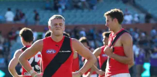 AFL reveals broader criteria behind Essendon assistance package decision ADELAIDE, AUSTRALIA - MARCH 22: Nate Caddy of the Bombers reacts after the loss as he waits for team mates to walk off the oval during the 2026 AFL Round 02 match between the Port Adelaide Power and the Essendon Bombers at Adelaide Oval on March 22, 2026 in Adelaide, Australia. (Photo by Sarah Reed/AFL Photos via Getty Images)