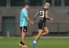 MELBOURNE, AUSTRALIA - MARCH 23: Craig McRae, Senior Coach of the Magpies and Bobby Hill of the Magpies are seen during the Collingwood Magpies training session at Olympic Park Oval on March 23, 2026 in Melbourne, Australia. (Photo by Michael Willson/AFL Photos via Getty Images)