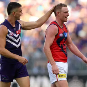 PERTH, AUSTRALIA - MARCH 21: Patrick Voss of the Dockers taunts Harrison Petty of the Demons during the round two AFL match between Fremantle Dockers and Melbourne Demons at Optus Stadium, on March 21, 2026, in Perth, Australia. (Photo by Janelle St Pierre/AFL Photos/via Getty Images)