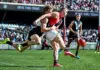 ADELAIDE, AUSTRALIA - MARCH 22: Nate Caddy of the Bombers 
 tackled by Miles Bergman of the Power during the round two AFL match between Port Adelaide Power and Essendon Bombers at Adelaide Oval, on March 22, 2026, in Adelaide, Australia. (Photo by Mark Brake/Getty Images)