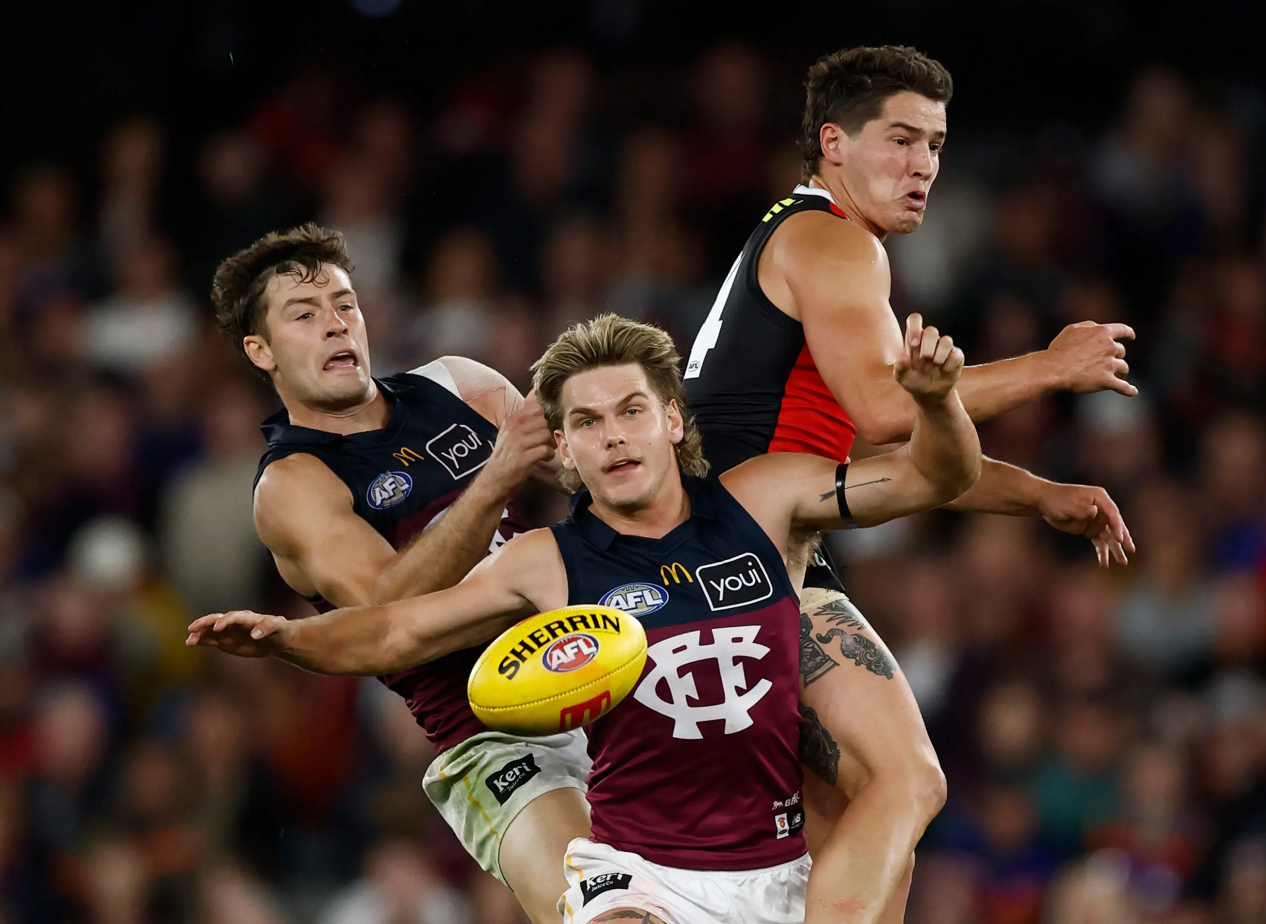 MELBOURNE, AUSTRALIA - MARCH 28: (L-R) Josh Dunkley of the Lions, Will Ashcroft of the Lions and Liam Stocker of the Saints compete for the ball during the 2026 AFL Round 03 match between the St Kilda Saints and the Brisbane Lions at Marvel Stadium on March 28, 2026 in Melbourne, Australia. (Photo by Michael Willson/AFL Photos via Getty Images)