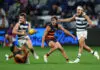 GEELONG, AUSTRALIA - MARCH 26: Izak Rankine of the Crows tackles Tom Atkins of the Cats during the round three AFL match between Geelong Cats and Adelaide Crows at GMHBA Stadium, on March 26, 2026, in Geelong, Australia. (Photo by Morgan Hancock/Getty Images)