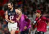 MELBOURNE, AUSTRALIA - MARCH 28: Darcy Gardiner of the Lions is helped from the ground by trainers during the round three AFL match between St Kilda Saints and Brisbane Lions at Marvel Stadium, on March 28, 2026, in Melbourne, Australia. (Photo by Quinn Rooney/Getty Images)