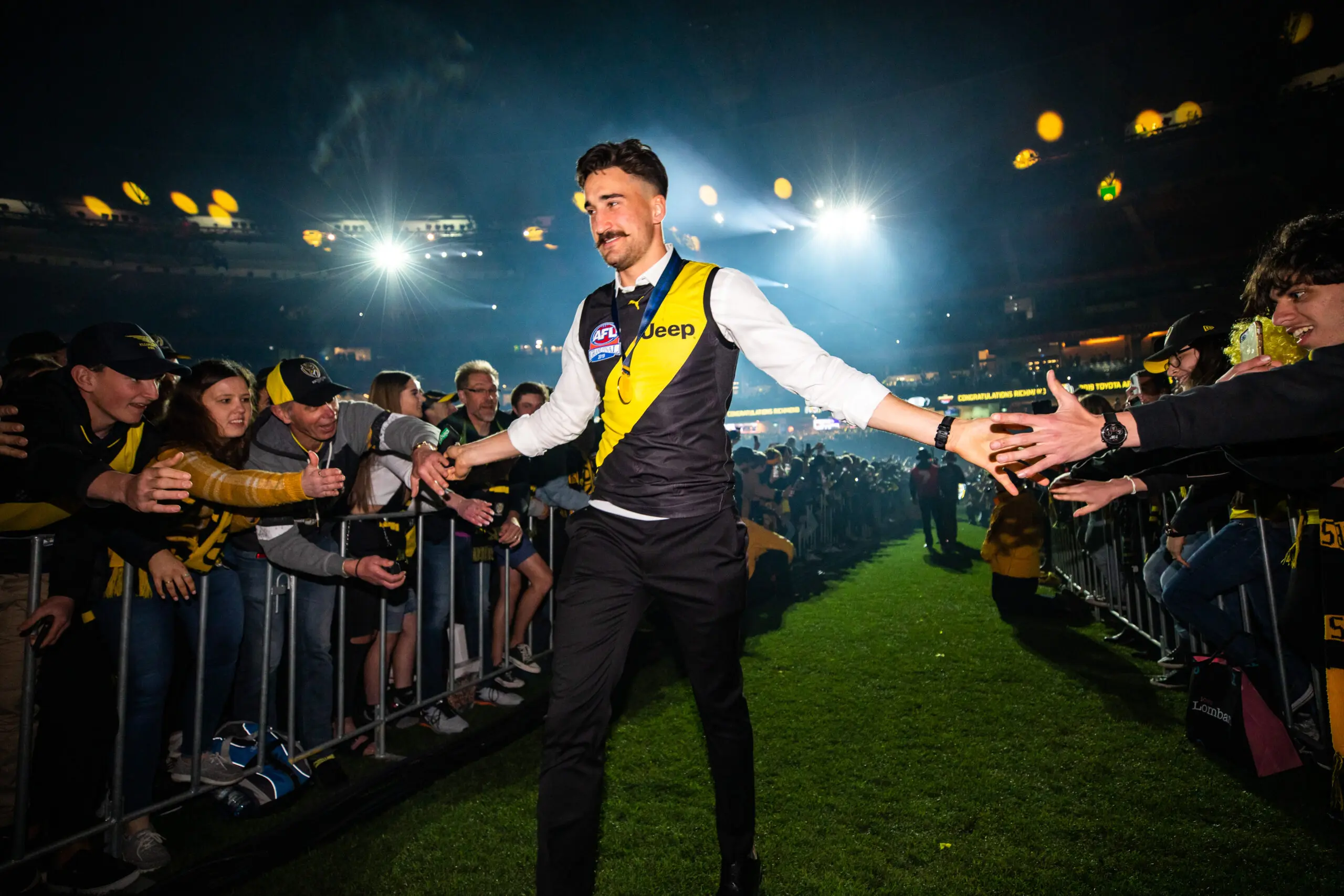 MELBOURNE, AUSTRALIA - SEPTEMBER 28: Ivan Soldo celebrates Richmonds Grand Final win at the MCG with fans on September 28, 2019 in Melbourne, Australia. (Photo by Mackenzie Sweetnam/Getty Images)