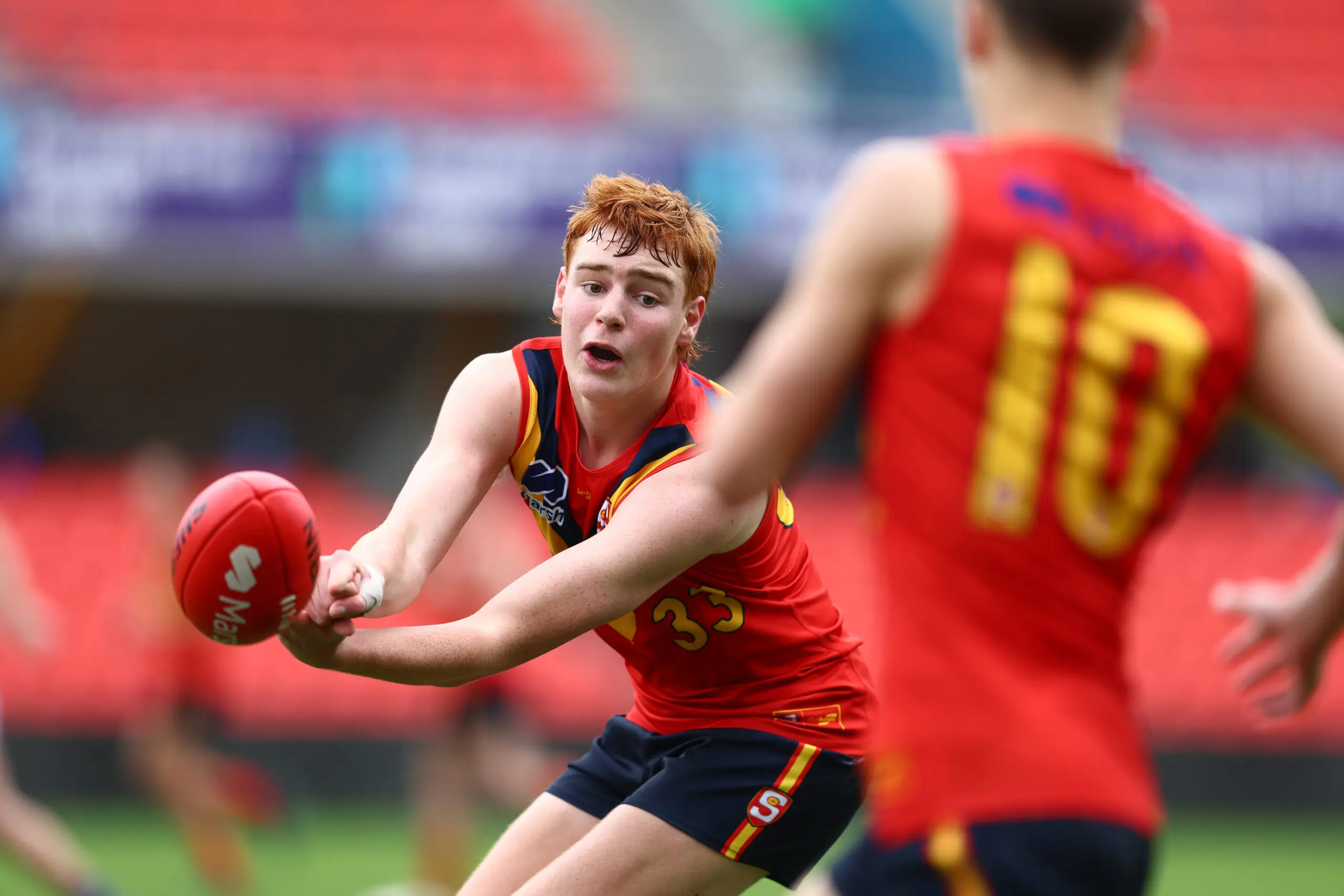 GOLD COAST, AUSTRALIA - JULY 09: Ethan Herbert of South Australia handballs during the Marsh AFL National Championships match between U16 Boys Victoria Metro and South Australia at People First Stadium on July 09, 2024 in Gold Coast, Australia. (Photo by Chris Hyde/AFL Photos/via Getty Images)