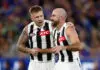 MELBOURNE, AUSTRALIA - MARCH 21: Jordan De Goey (left) and Steele Sidebottom of the Magpies are seen during the 2025 AFL Round 02 match between the Footscray Bulldogs and the Collingwood Magpies at the Melbourne Cricket Ground on March 21, 2025 in Melbourne, Australia. (Photo by Michael Willson/AFL Photos via Getty Images)