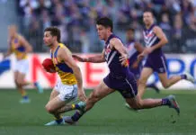 PERTH, AUSTRALIA - JULY 26: Andrew Brayshaw of the Dockers tackles Liam Baker of the Eagles during the round 20 AFL match between the Fremantle Dockers and West Coast Eagles at Optus Stadium on July 26, 2025 in Perth, Australia. (Photo by Paul Kane/Getty Images)