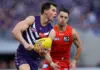 PERTH, AUSTRALIA - SEPTEMBER 06: Jaeger O'Meara of the Dockers handpasses the ball during the AFL Elimination Final match between Fremantle Dockers and Gold Coast Suns at Optus Stadium on September 06, 2025 in Perth, Australia. (Photo by Janelle St Pierre/AFL Photos/via Getty Images)