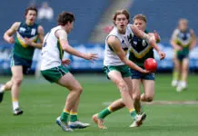 The SIX AFL Draft prospects debuting in state-league competitions MELBOURNE, AUSTRALIA - SEPTEMBER 27: Archie Van Dyk of Team Boak handballs whilst being tackled by Heath Mellody of Team Docherty during the Marsh AFL National Futures Boys match between Team Boak and Team Docherty at Melbourne Cricket Ground, on September 27, 2025 in Melbourne, Australia. (Photo by Josh Chadwick/AFL Photos/via Getty Images)