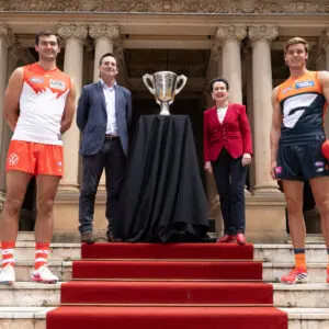 SYDNEY, AUSTRALIA - MARCH 02:  Logan McDonald of the Sydney Swans, AFL CEO Andrew Dillon, Lord Mayor of Sydney Clover Moore and Aaron Cadman of the GWS GIANTS pose with the 2026 AFL Premiership cup at the 2026 AFL Opening Round Media Opportunity at the Sydney Town Hall on March 02, 2026 in Sydney, Australia. (Photo by Mark Kolbe/AFL Photos/via Getty Images)