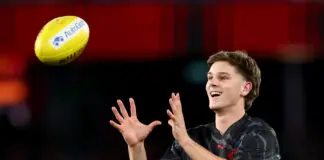 MELBOURNE, AUSTRALIA - MARCH 28: Jacob Farrow of the Bombers warms up ahead of his debut game during the round three AFL match between Essendon Bombers and North Melbourne Kangaroos at Marvel Stadium, on March 28, 2026, in Melbourne, Australia. (Photo by Josh Chadwick/Getty Images)