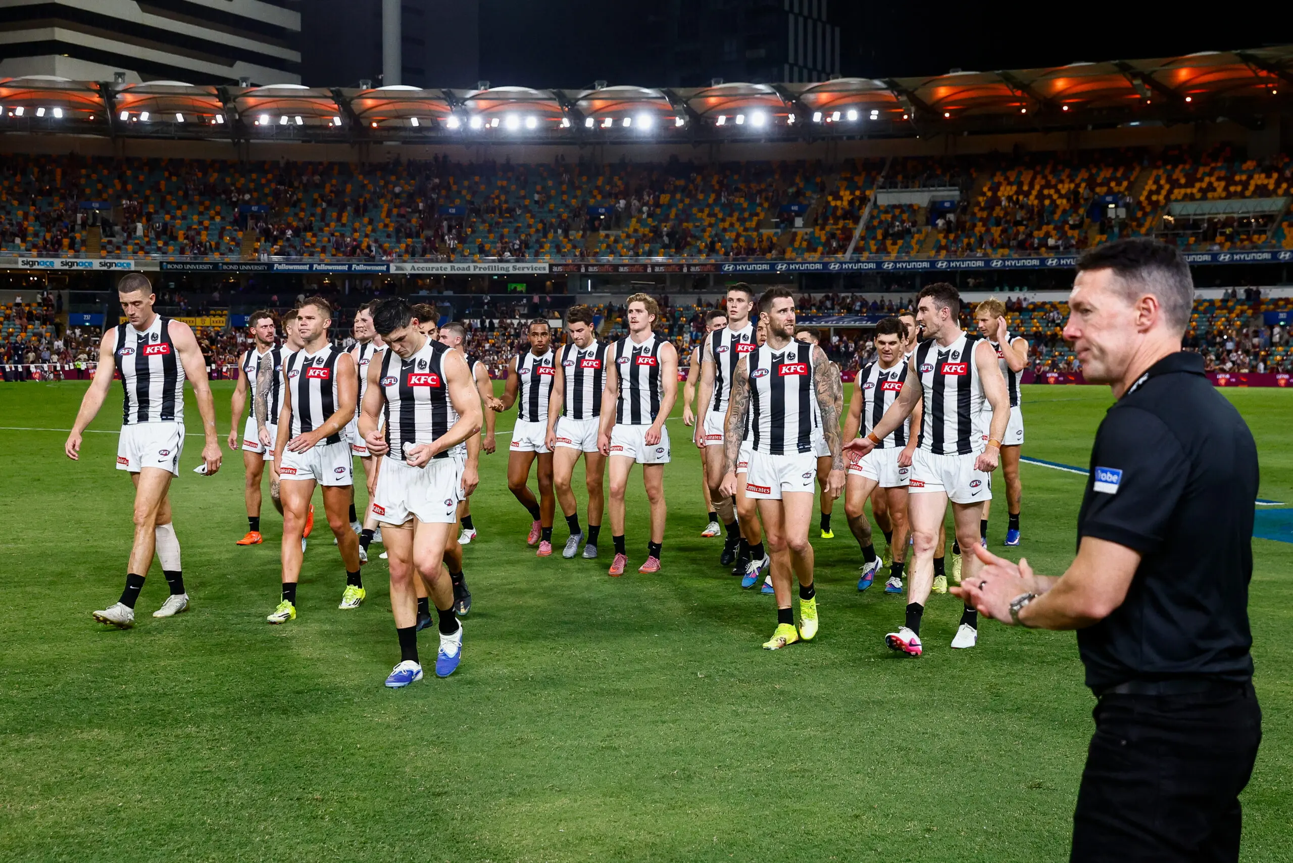BRISBANE, AUSTRALIA - APRIL 02: Craig McRae, Senior Coach of the Magpies looks on as Collingwood exit the field following the 2026 AFL Round 04 match between the Brisbane Lions and the Collingwood Magpies at the Gabba on April 2, 2026 in Brisbane, Australia. (Photo by Russell Freeman/AFL Photos via Getty Images)