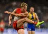 PERTH, AUSTRALIA - APRIL 04: Isaac Heeney of the Swans kicks the ball during the 2026 AFL Round 04 match between the West Coast Eagles and the Sydney Swans at Optus Stadium on April 4, 2026 in Perth, Australia. (Photo by Daniel Carson/AFL Photos via Getty Images)
