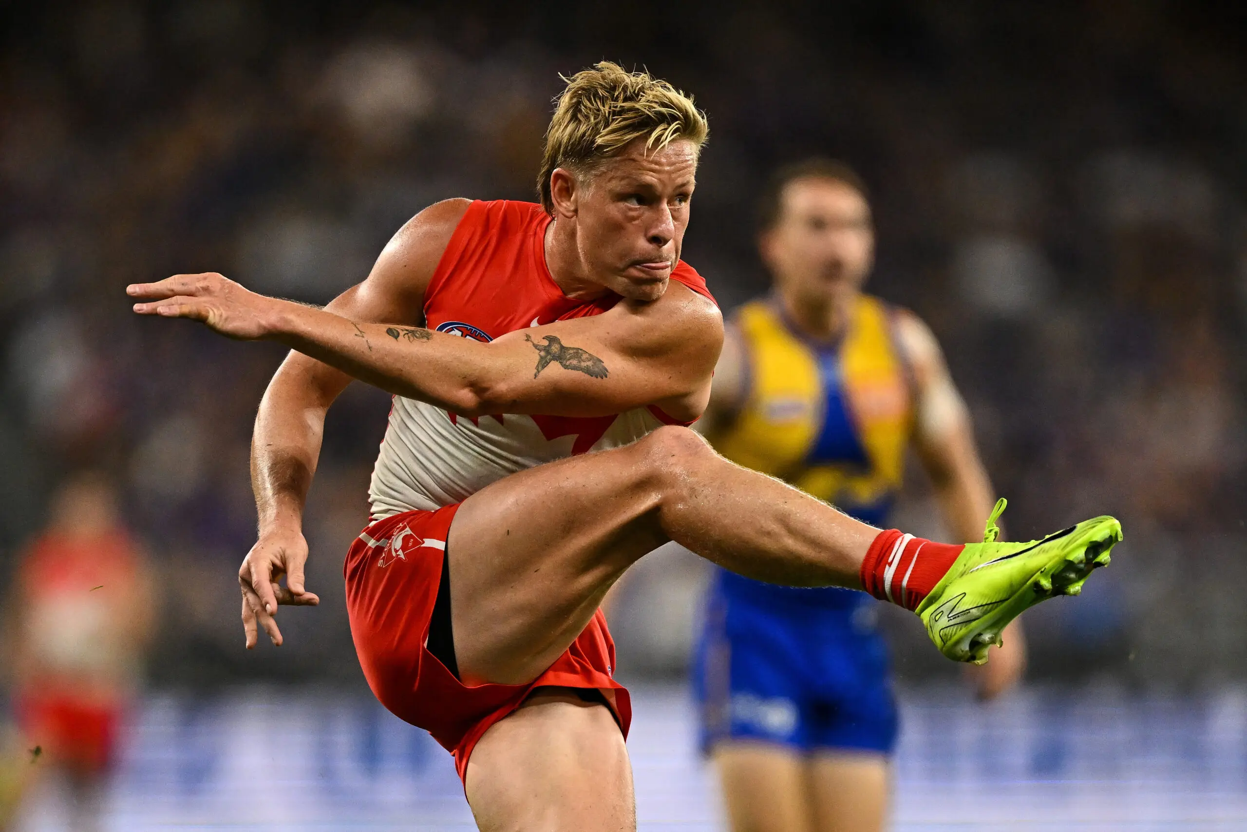 PERTH, AUSTRALIA - APRIL 04: Isaac Heeney of the Swans kicks the ball during the 2026 AFL Round 04 match between the West Coast Eagles and the Sydney Swans at Optus Stadium on April 4, 2026 in Perth, Australia. (Photo by Daniel Carson/AFL Photos via Getty Images)