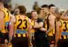 MELBOURNE, AUSTRALIA - APRIL 06: Sam Mitchell, Senior Coach of the Hawks celebrates with his players during the 2026 AFL Round 04 match between the Hawthorn Hawks and the Geelong Cats at the Melbourne Cricket Ground on April 6, 2026 in Melbourne, Australia. (Photo by Michael Willson/AFL Photos via Getty Images)