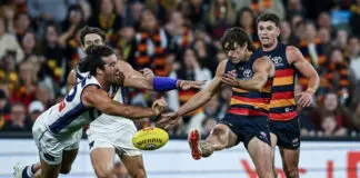 Longmuir claims ‘desperate’ Dockers learning from past mistakes after scratchy win ADELAIDE, AUSTRALIA - APRIL 03: Alex Pearce of the Dockers smothers a kick for goal by James Peatling of the Crows during the round four AFL match between Adelaide Crows and Fremantle Dockers at Adelaide Oval, on April 03, 2026, in Adelaide, Australia. (Photo by Mark Brake/Getty Images)