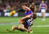ADELAIDE, AUSTRALIA - APRIL 10: Ed Richards of the Bulldogs and Cam Mackenzie of the Hawks during the 2026 AFL Round 05 match between the Hawthorn Hawks and the Western Bulldogs at Adelaide Oval on April 10, 2026 in Adelaide, Australia. (Photo by Sarah Reed/AFL Photos via Getty Images)