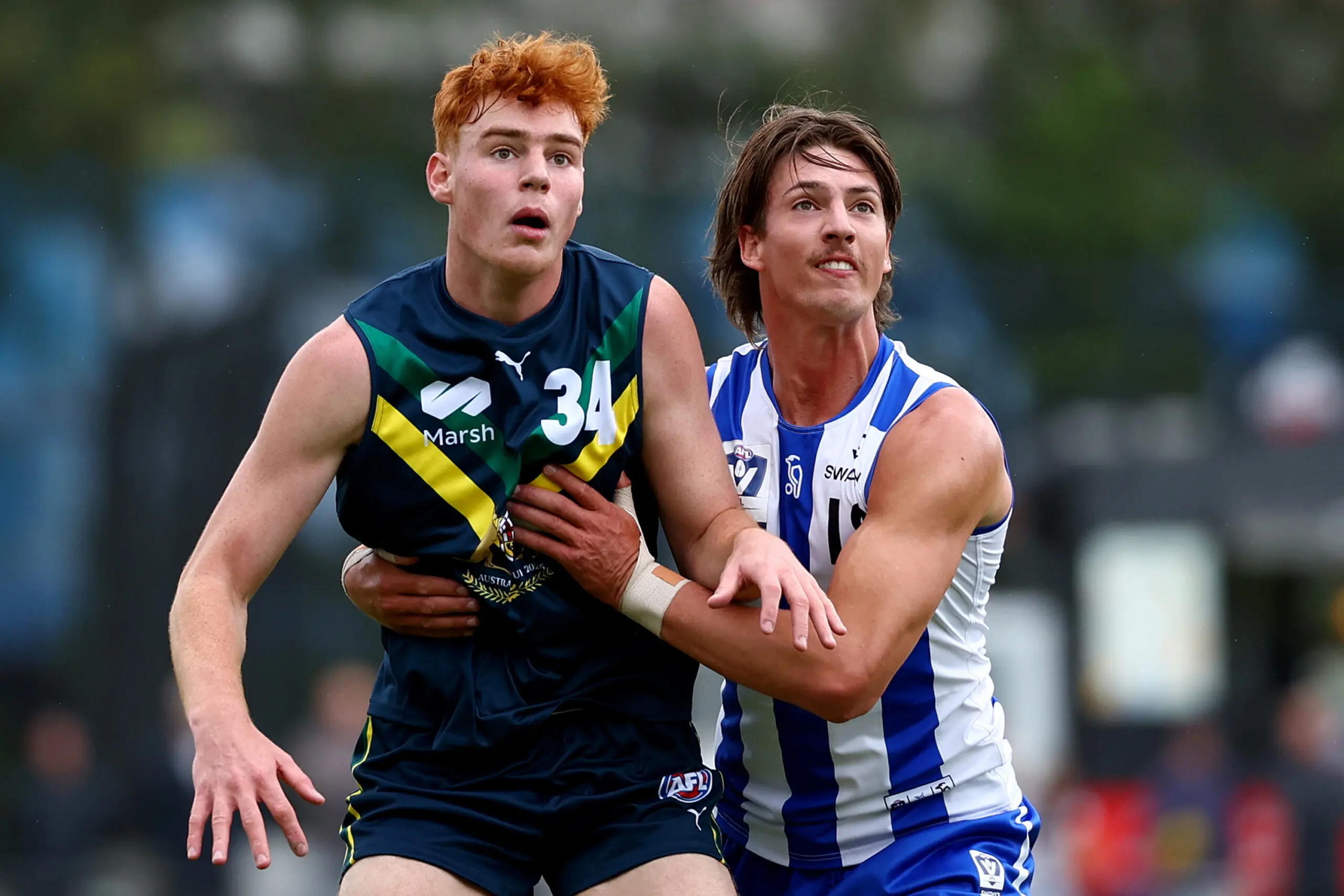 MELBOURNE, AUSTRALIA - APRIL 12: Ethan Herbert of the AFL National Academy and Wil Dawson of the Kangaroos compete in the ruck during the Marsh AFL National Academy Boys match between Australia U18 and North Melbourne VFL at Arden Street Ground on April 12, 2026 in Melbourne, Australia. (Photo by Josh Chadwick/AFL Photos/via Getty Images)