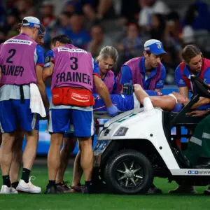 MELBOURNE, AUSTRALIA - APRIL 23: Aaron Naughton of the Bulldogs leaves the field on a stretcher during the 2026 AFL Round 07 match between the Western Bulldogs and the Sydney Swans at Marvel Stadium on April 23, 2026 in Melbourne, Australia. (Photo by Michael Willson/AFL Photos via Getty Images)