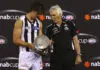 MELBOURNE, AUSTRALIA - MARCH 11:  Scott Pendlebury and Mick Malthouse the coach of the Magpies look at the trophy after winning the NAB Cup AFL Grand Final match between the Essendong Bombers and the Collingwood Magpies at Etihad Stadium on March 11, 2011 in Melbourne, Australia.  (Photo by Quinn Rooney/Getty Images)