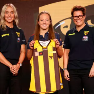 MELBOURNE, AUSTRALIA - JUNE 29: Number 2 pick Jasmine Fleming poses with Kaitlyn Ashmore and Bec Goddard, Coach of the Hawks during the 2022 NAB AFLW Draft at Marvel Stadium on June 29, 2022 in Melbourne, Australia. (Photo by Michael Willson/AFL Photos via Getty Images)