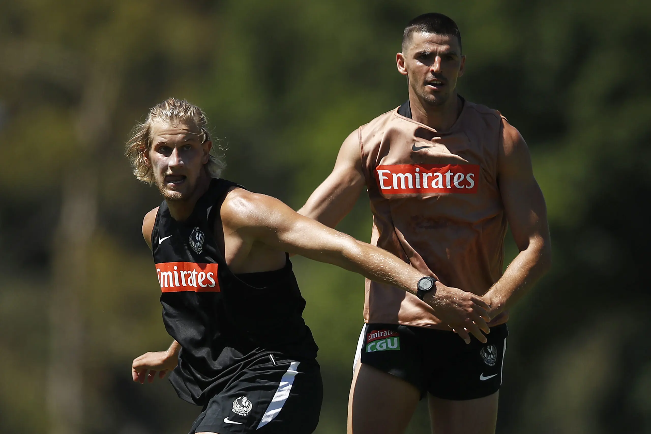 MELBOURNE, AUSTRALIA - JANUARY 08: Thomas Wilson of the Magpies (L) and Scott Pendlebury of the Magpies compete during a Collingwood Magpies AFL training session at Holden Centre on January 08, 2021 in Melbourne, Australia. (Photo by Daniel Pockett/Getty Images)
