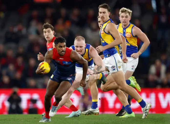 MELBOURNE, AUSTRALIA - AUGUST 02: Kysaiah Pickett of the Demons is chased by Bailey J. Williams of the Eagles during the 2025 AFL Round 21 match between the Melbourne Demons and the West Coast Eagles at Marvel Stadium on August 2, 2025 in Melbourne, Australia. (Photo by Michael Willson/AFL Photos via Getty Images)