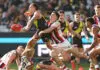 MELBOURNE, AUSTRALIA - AUGUST 09:  Rhyan Mansell of the Tigers handpasses the ball with Anthony Caminiti of the Saints during the 2025 AFL Round 22 match between the Richmond Tigers and the St Kilda Saints at the Melbourne Cricket Ground on August 9, 2025 in Melbourne, Australia. (Photo by James Wiltshire/AFL Photos via Getty Images)