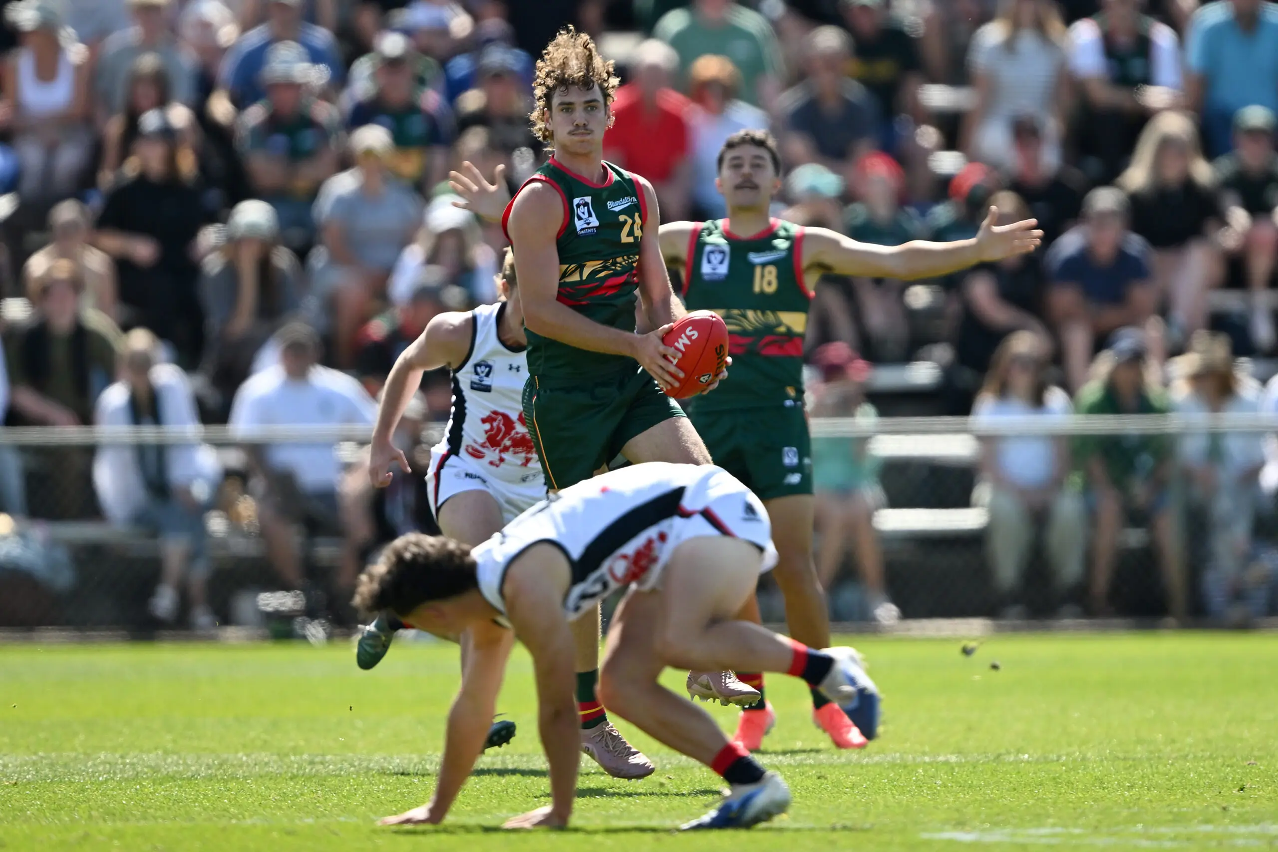 HOBART, AUSTRALIA - MARCH 21: Jaxon Artemis of the Devils in action during the round one VFL match between Tasmania Devils and Coburg Lions at North Hobart Oval on March 21, 2026 in Hobart, Australia. (Photo by Steve Bell/Getty Images)