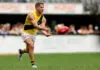 PERTH, AUSTRALIA - MARCH 28: Dion Prestia of the Tigers handpasses the ball  during the round three AFL match between Fremantle Dockers and Richmond Tigers at Optus Stadium, on March 28, 2026, in Perth, Australia. (Photo by Janelle St Pierre/AFL Photos/via Getty Images)