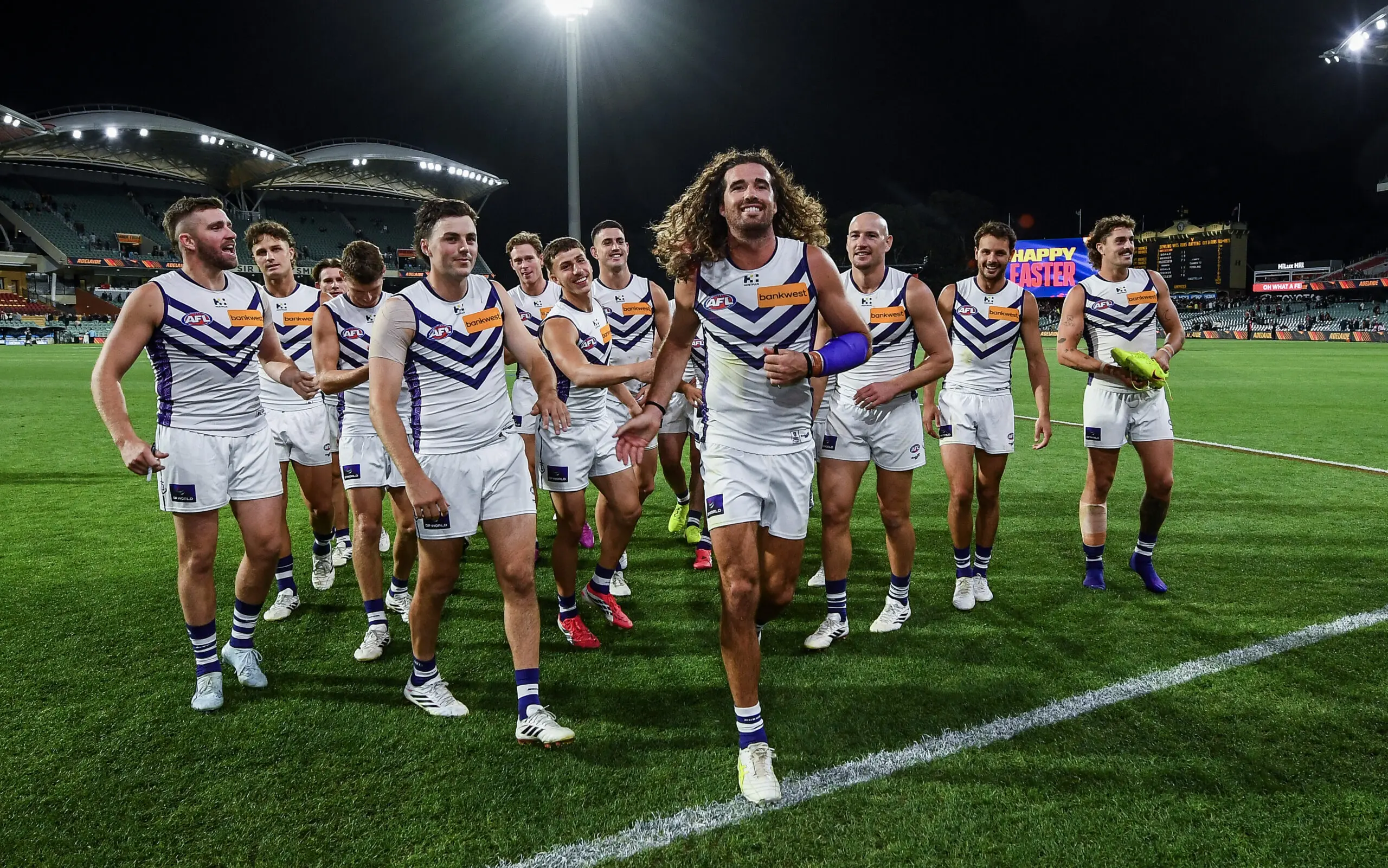 ADELAIDE, AUSTRALIA - APRIL 03:The Dockers celebrate as Alex Pearce of the Dockers leads his team off during the round four AFL match between Adelaide Crows and Fremantle Dockers at Adelaide Oval, on April 03, 2026, in Adelaide, Australia. (Photo by Mark Brake/Getty Images)
