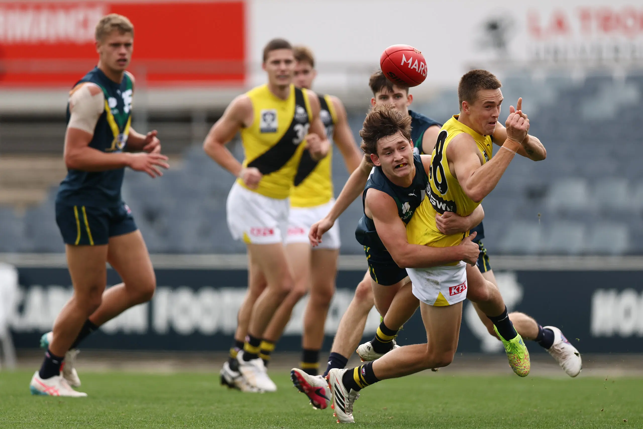 MELBOURNE, AUSTRALIA - APRIL 18: Sam Toner of the Tigers handballs during the Marsh AFL National Academy Boys match between Australia U18 and Richmond VFL at Ikon Park on April 18, 2026 in Melbourne, Australia. (Photo by Morgan Hancock/AFL Photos/via Getty Images)